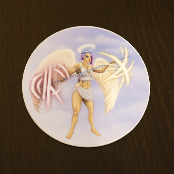 Photograph of the angel warrior sticker available in the Copious Ink Etsy store.