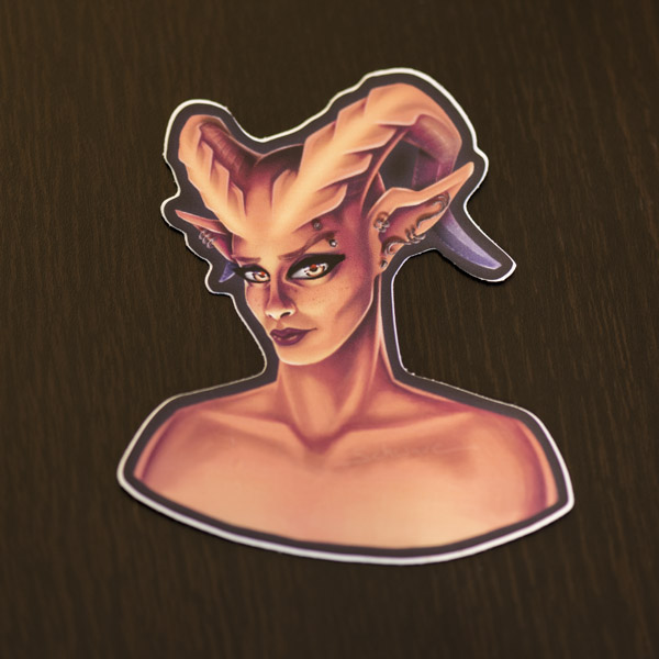 Photograph of the demon lady sticker available in the Copious Ink Etsy store.