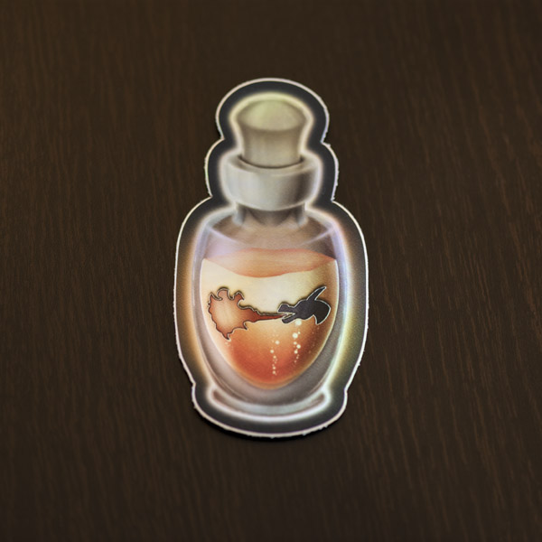 Photograph of the potion of dragon's breath sticker (holographic) available in the Copious Ink Etsy store.