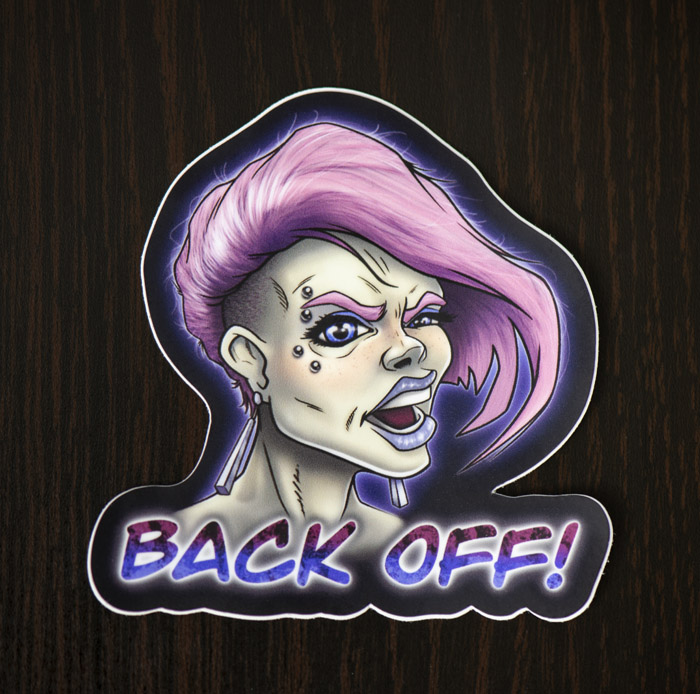 Photograph of the punk woman yelling back off sticker available in the Copious Ink Etsy store.